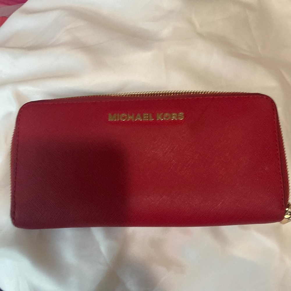 Micheal Kors red wallet.